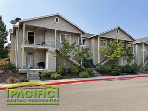 Medford apartment for rent - a home with a parking lot in front of it