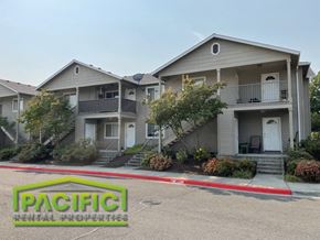Medford apartment for rent - an apartment building with a parking lot in front of it