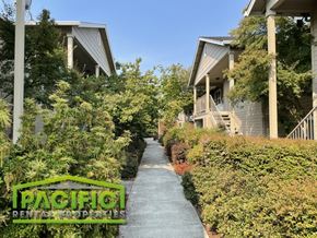 Medford apartment for rent - a walkway leading to a row of houses