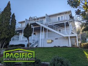 Ashland apartment for rent - a large white house on a hill with stairs
