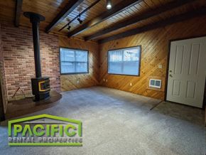Ashland apartment for rent - the living room of a home with a wood burning stove
