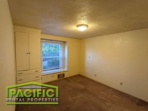 Ashland apartment for rent - the bedroom of a house with a carpeted floor and a window