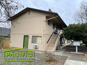 Ashland apartment for rent - the front of a house with stairs and a green door