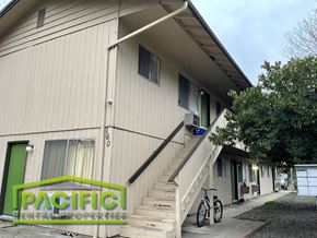 Ashland apartment for rent - a building with stairs and two bikes in front of it