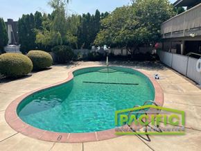 Medford apartment for rent - a swimming pool in a backyard next to a building
