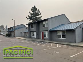 Medford apartment for rent - a commercial building with a parking lot in front of it
