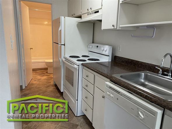 Medford apartment for rent - a kitchen with a stove refrigerator and a sink