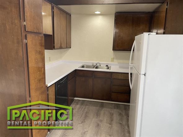 Medford apartment for rent - a small kitchen with a refrigerator and a sink