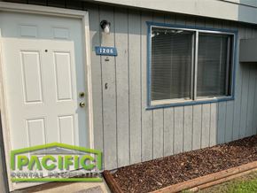 Medford apartment for rent - a gray house with a white door and a window