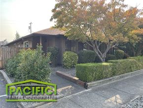 Medford apartment for rent - A house with a sign that says Pacific in front of it.