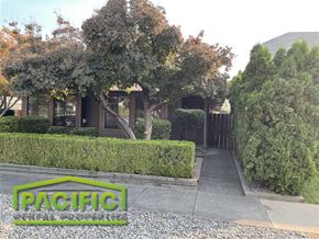 Medford apartment for rent - A house with a green lawn and trees in front of it.