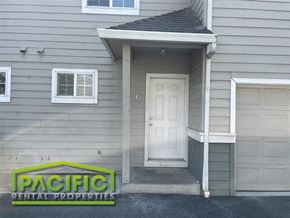 Medford apartment for rent - A Pacific Rental Properties sign is on the front of a house.