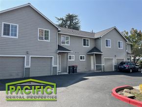 Medford apartment for rent - A building with the words "PACIFIC RENTAL PROPERTIES" on the front sign.