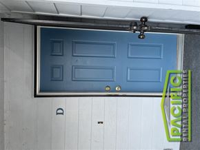 Rogue River apartment for rent - a blue door on the side of a garage