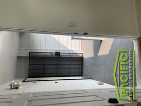 Rogue River apartment for rent - a view of a garage door from the inside of a building