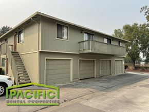 Medford apartment for rent - a home with a garage and a balcony on the side
