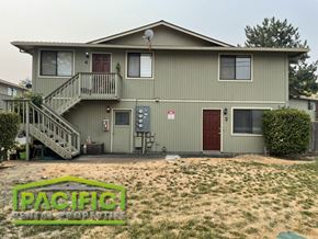 Medford apartment for rent - a green house with a front yard and a porch