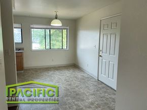 Ashland apartment for rent - the living room of an empty house with a window