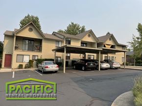 Ashland apartment for rent - a building with cars parked in a parking lot