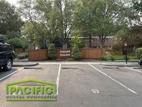 Ashland apartment for rent - an empty parking lot with a parking lot sign in front of a building