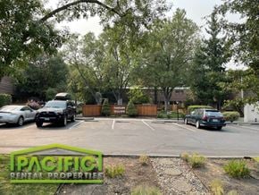 Ashland apartment for rent - a parking lot with cars parked in it
