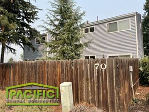 Ashland apartment for rent - a wooden fence in front of a house