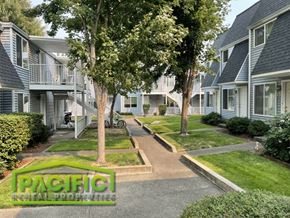 Ashland apartment for rent - a row of town houses with trees in front of them