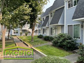 Ashland apartment for rent - a row of houses in a neighborhood with trees and grass