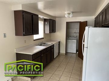 Ashland apartment for rent - a kitchen with a sink and a refrigerator