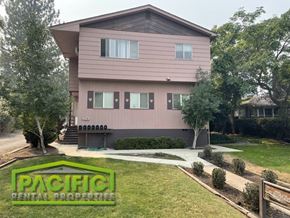 Ashland apartment for rent - a house with a driveway and a lawn in front of it