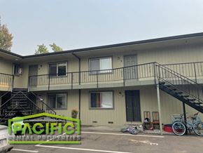 Ashland apartment for rent - the front of a building with stairs and a sign