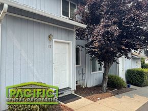 Ashland apartment for rent - a blue house with a white door and a tree