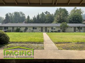 Ashland apartment for rent - a house with a lawn and trees in the background