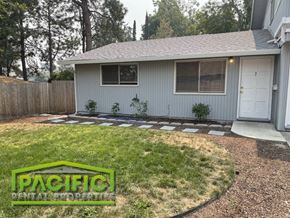 Ashland apartment for rent - A house with a Pacific Rental Properties sign in the front yard.