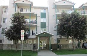 Regina condo for rent - Apartment complex with a no parking sign in front.