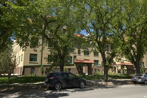Regina apartment for rent - A black car is parked on the side of a street.