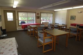 Regina apartment for rent - A room with tables and chairs and a window.