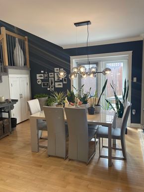 Regina condo for rent - A dining room with a table and chairs.