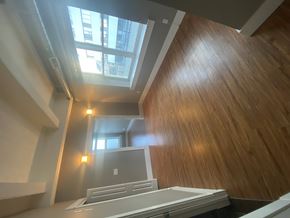 Regina condo for rent - A large well lit room.