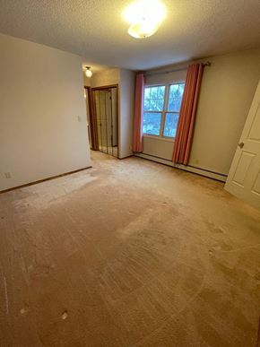 Regina condo for rent - A room with a window and a door.