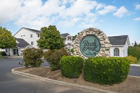 Spokane apartment for rent - the sign estates with houses in the background