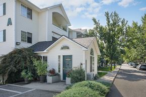 Spokane Valley apartment for rent - the front of a white house with a blue door