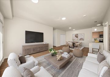 Spokane apartment for rent - A living room with a white couch and a wooden coffee table.