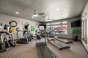 Spokane apartment for rent - A gym with treadmills, elliptical machines, and other exercise equipment.
