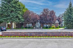 Spokane apartment for rent - a street with houses and trees and a fountain