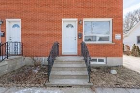 Galt East apartment for rent - the front of a brick building with a white door and stairs