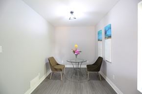 London apartment for rent - a small dining room with a glass table and two chairs