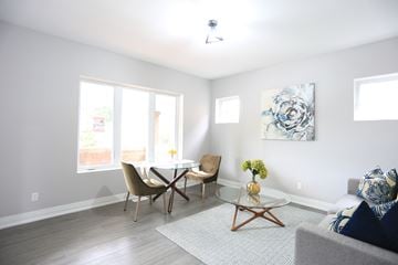 London apartment for rent - a living room with a table and chairs and a couch