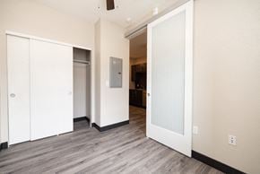 Arvada apartment for rent - a view of a living room with white walls and wood floors