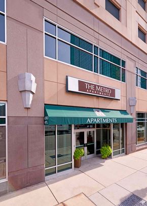 Minneapolis apartment for rent - The Metro Apartments building has a green awning.